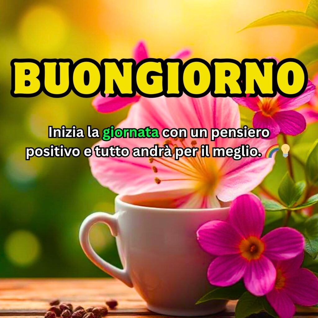 Una tazza di caffè circondata da splendidi fiori rosa, con un messaggio motivazionale di buongiorno.